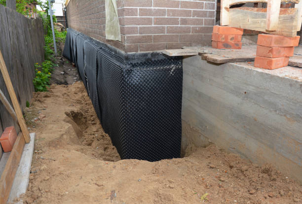 Happy homeowners after waterproofing job in Jarrettsville